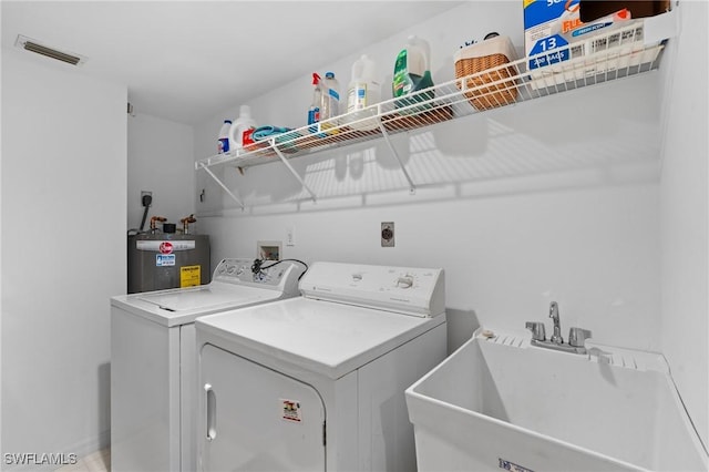 270 Naples Cove Dr Unit 3205, Naples, FL 34110 - laundry area with laundry area, visible vents, a sink, separate washer and dryer, and water heater