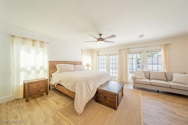 bedroom featuring access to outside, light wood finished floors, ceiling fan, and visible vents