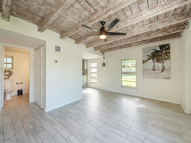 158 4th St, Naples, FL 34113 - unfurnished living room featuring beamed ceiling, a ceiling fan, and baseboards