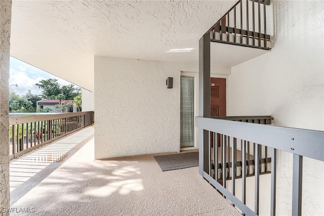 property entrance featuring stucco siding