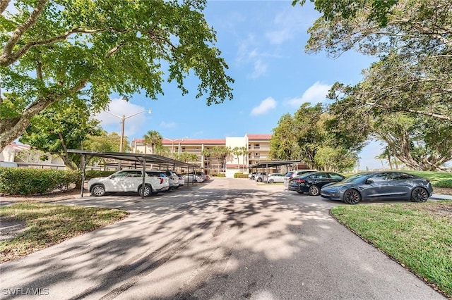 view of partially covered parking lot