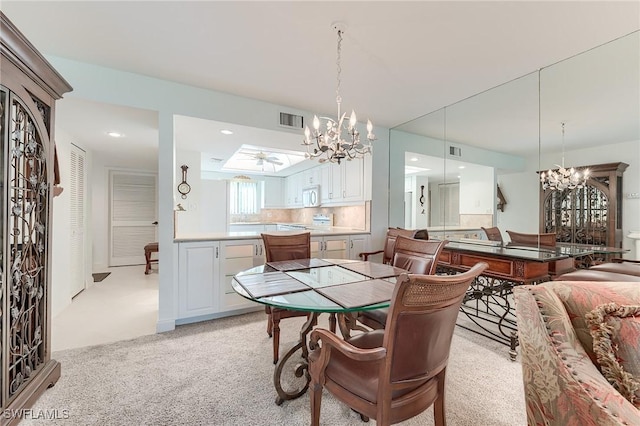 dining area featuring visible vents, recessed lighting, a chandelier, and light colored carpet
