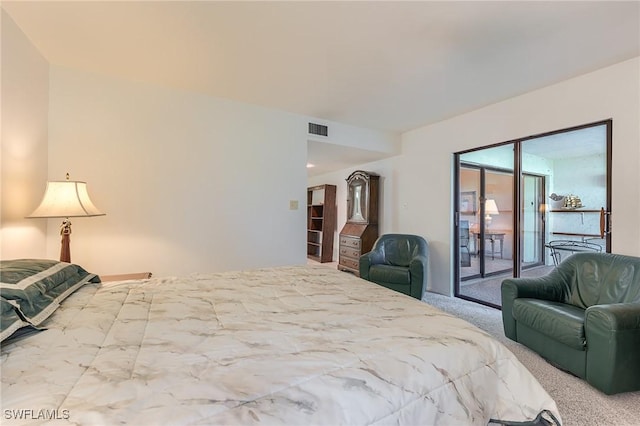 bedroom with carpet flooring, access to outside, and visible vents