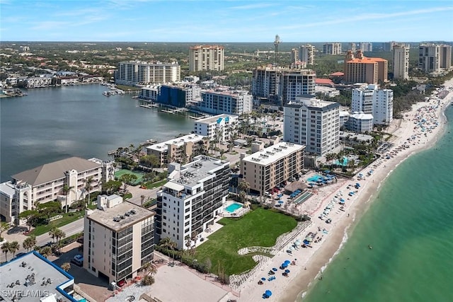 bird's eye view with a beach view, a water view, and a city view