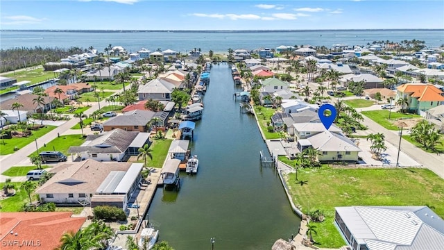 aerial view featuring a water view and a residential view