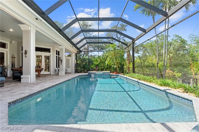933 Barcarmil Way, Naples, FL 34110 - view of pool with french doors, a pool with connected hot tub, a patio, and glass enclosure