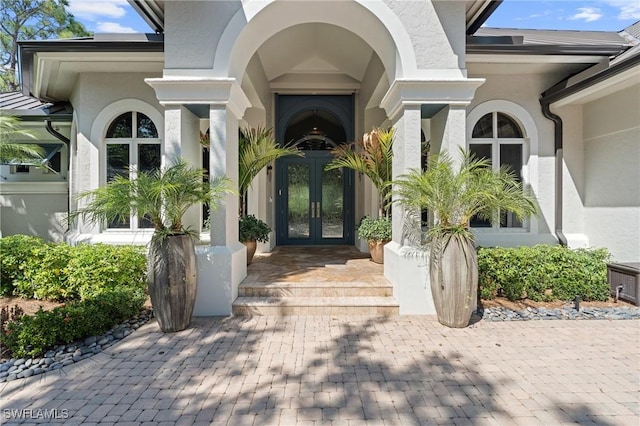 933 Barcarmil Way, Naples, FL 34110 - property entrance featuring french doors and stucco siding