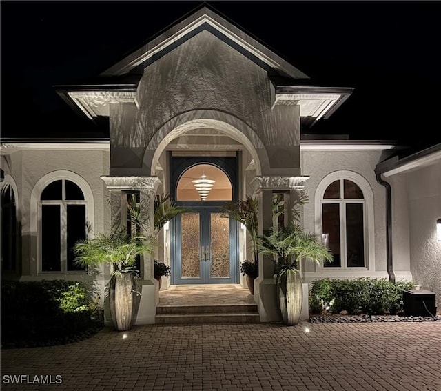 933 Barcarmil Way, Naples, FL 34110 - doorway to property with french doors and stucco siding