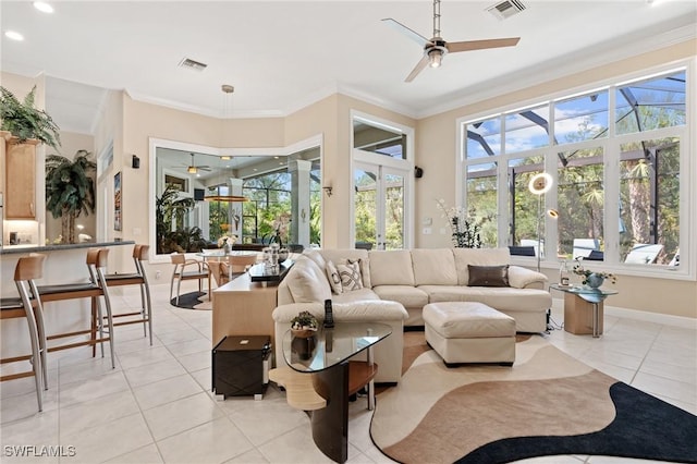 933 Barcarmil Way, Naples, FL 34110 - living room featuring ornamental molding, visible vents, and ceiling fan