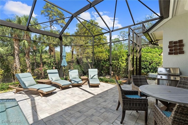 933 Barcarmil Way, Naples, FL 34110 - view of patio with a grill, outdoor dining area, and glass enclosure