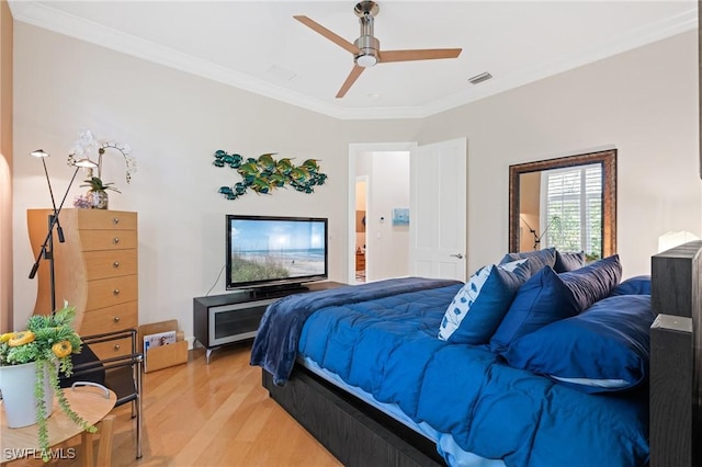 933 Barcarmil Way, Naples, FL 34110 - bedroom featuring light wood-style flooring, a ceiling fan, ornamental molding, and visible vents