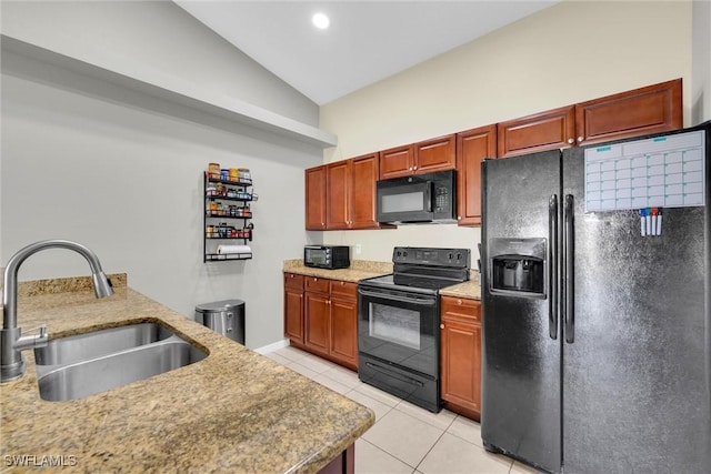 kitchen with lofted ceiling, recessed lighting, light tile patterned floors, a sink, and black appliances