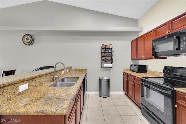 kitchen with a sink, light stone countertops, black appliances, and vaulted ceiling