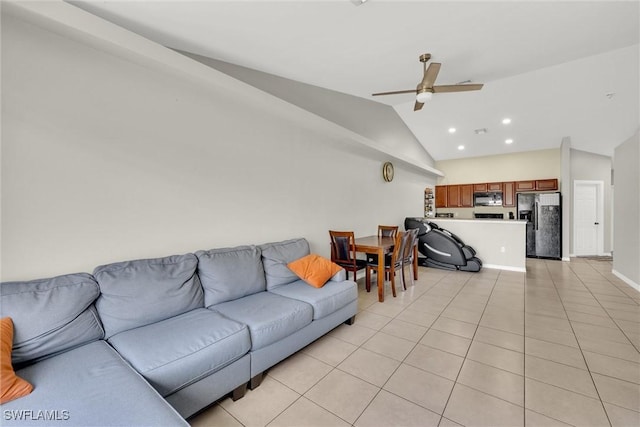 living room with baseboards, ceiling fan, recessed lighting, lofted ceiling, and light tile patterned floors