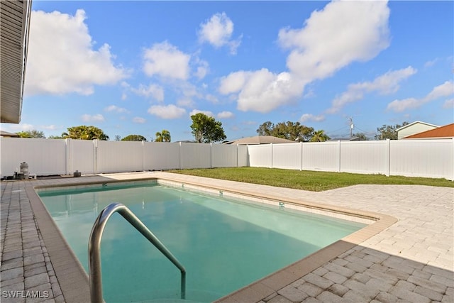 1725 SE 3rd St, Cape Coral, FL 33990 - view of swimming pool with a fenced in pool, a patio area, a fenced backyard, and a yard