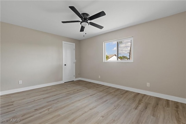 1725 SE 3rd St, Cape Coral, FL 33990 - empty room with light wood-style flooring, baseboards, and ceiling fan