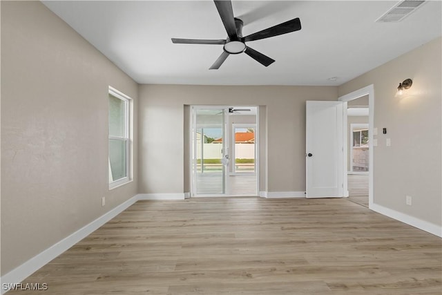 1725 SE 3rd St, Cape Coral, FL 33990 - spare room featuring light wood-type flooring, baseboards, a ceiling fan, and visible vents