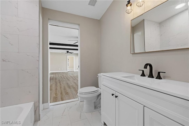 1725 SE 3rd St, Cape Coral, FL 33990 - full bath featuring a tub, a ceiling fan, visible vents, toilet, and marble finish floor