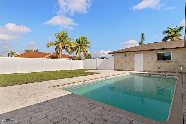 1725 SE 3rd St, Cape Coral, FL 33990 - view of pool featuring a fenced in pool, a yard, a patio area, and a fenced backyard