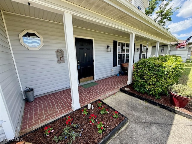 doorway to property featuring a porch