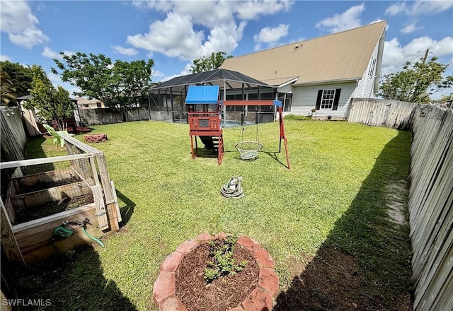view of yard featuring a fenced backyard and glass enclosure