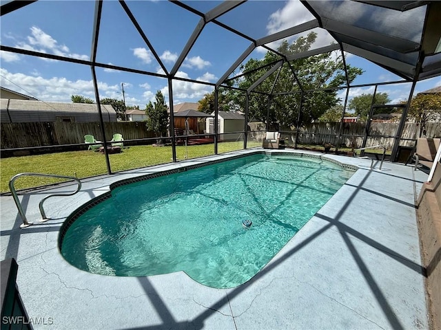 view of pool with a fenced backyard, a fenced in pool, a patio area, and a lawn