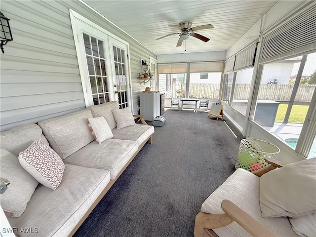 sunroom / solarium with an outdoor living space and a ceiling fan
