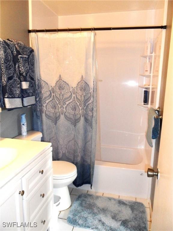 full bath with shower / tub combo with curtain, toilet, tile patterned floors, and vanity