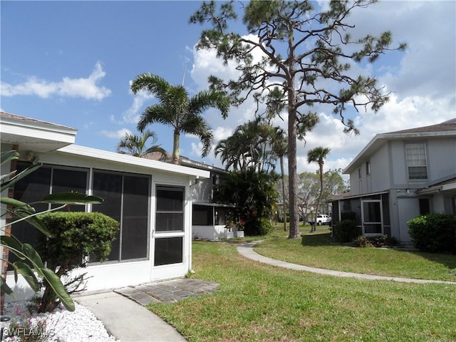 view of yard featuring a sunroom