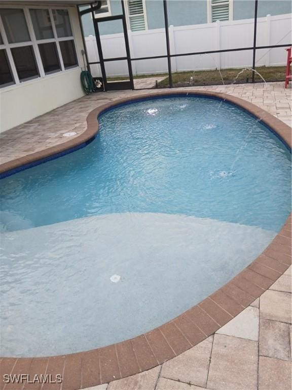 2138 Bahama Ave, Fort Myers, FL 33905 - view of swimming pool featuring a patio, fence, and glass enclosure