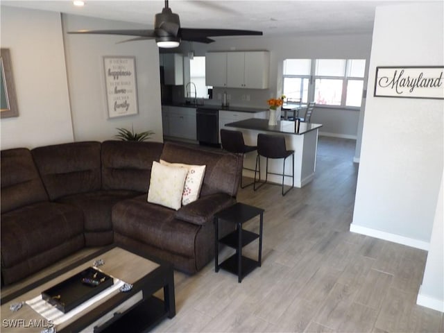 2138 Bahama Ave, Fort Myers, FL 33905 - living area with baseboards, a ceiling fan, and light wood-style floors