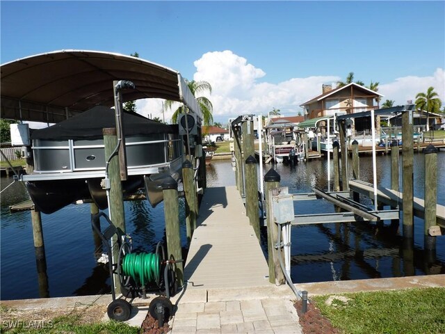 2138 Bahama Ave, Fort Myers, FL 33905 - dock featuring boat lift and a water view