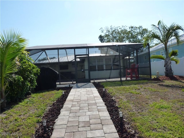 2138 Bahama Ave, Fort Myers, FL 33905 - rear view of property featuring glass enclosure and fence