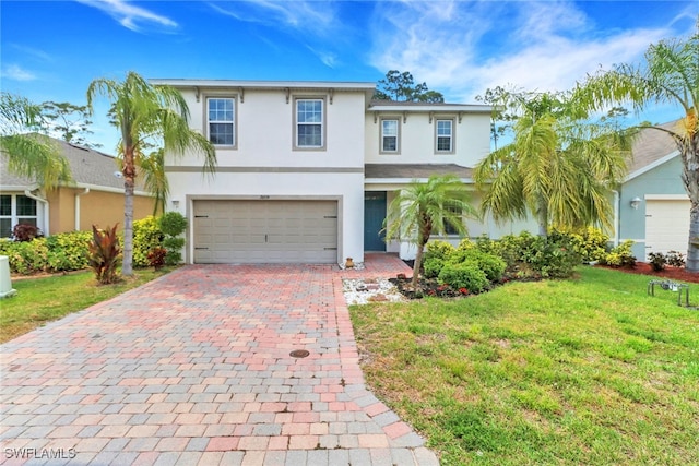 26974 Wildwood Pines Ln, Bonita Springs, FL 34135 - traditional-style home featuring stucco siding, decorative driveway, an attached garage, and a front lawn
