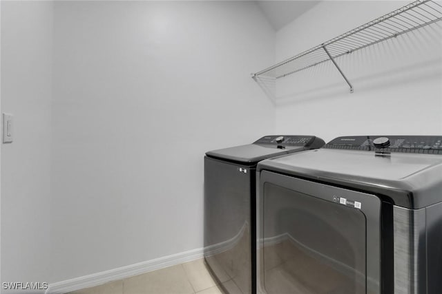 26974 Wildwood Pines Ln, Bonita Springs, FL 34135 - laundry room with independent washer and dryer, baseboards, and light tile patterned flooring