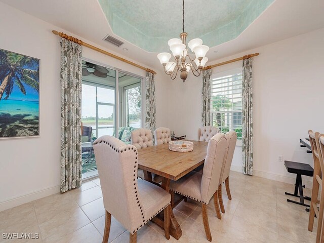 584 Avellino Isles Cir Unit 19102, Naples, FL 34119 - dining space with a chandelier, healthy amount of natural light, and baseboards