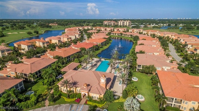 birds eye view of property featuring a residential view and a water view