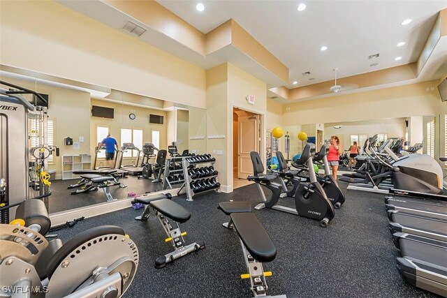 584 Avellino Isles Cir Unit 19102, Naples, FL 34119 - workout area featuring recessed lighting and a towering ceiling