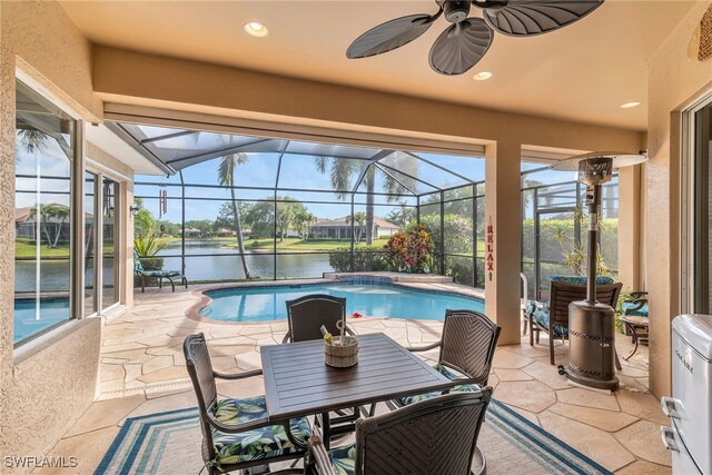 6806 Bent Grass Dr, Naples, FL 34113 - outdoor pool featuring a water view, a lanai, a patio, outdoor dining space, and a ceiling fan