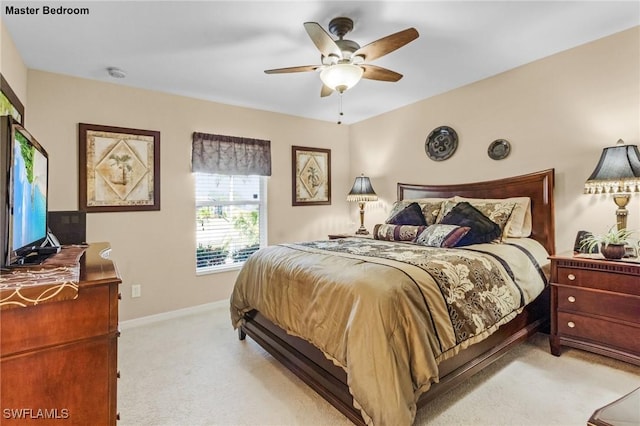 924 NE 11th Ave, Cape Coral, FL 33909 - bedroom with baseboards, carpet flooring, and a ceiling fan
