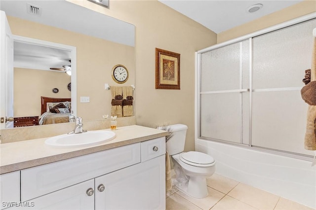 924 NE 11th Ave, Cape Coral, FL 33909 - bathroom with vanity, toilet, tile patterned floors, ensuite bath, and visible vents