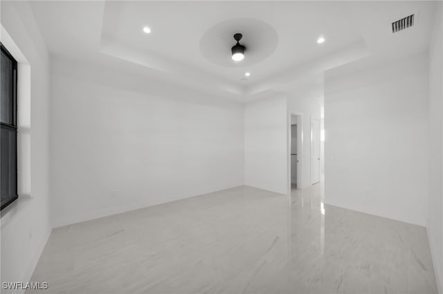1412 SW 20th Ave, Cape Coral, FL 33991 - spare room featuring a tray ceiling, visible vents, recessed lighting, and a ceiling fan