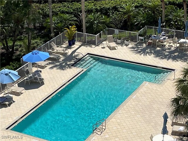 6361 Pelican Bay Blvd Unit 605, Naples, FL 34108 - pool with a patio area