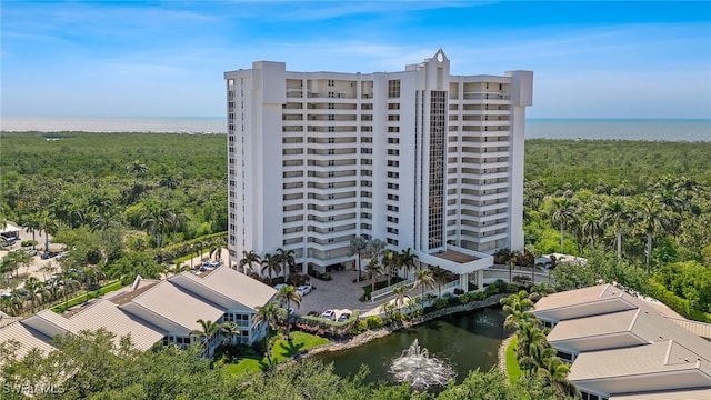 6361 Pelican Bay Blvd Unit 605, Naples, FL 34108 - birds eye view of property with a water view and a view of trees