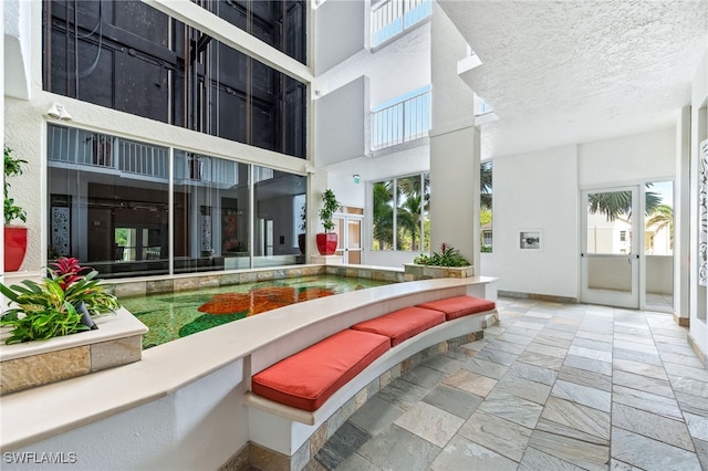 6361 Pelican Bay Blvd Unit 605, Naples, FL 34108 - exterior space featuring a patio