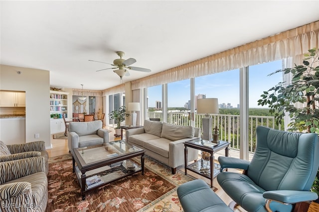 6361 Pelican Bay Blvd Unit 605, Naples, FL 34108 - living room with ceiling fan and a city view