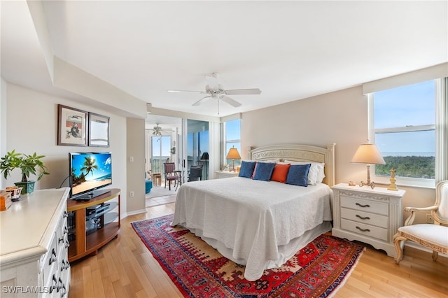 6361 Pelican Bay Blvd Unit 605, Naples, FL 34108 - bedroom featuring access to exterior, a ceiling fan, light wood-style floors, and baseboards