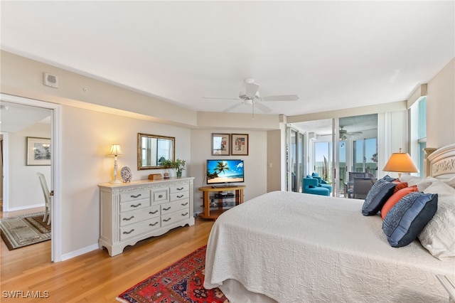 6361 Pelican Bay Blvd Unit 605, Naples, FL 34108 - bedroom with light wood-style flooring, access to outside, ceiling fan, and baseboards