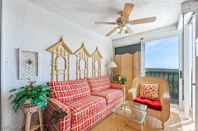 6361 Pelican Bay Blvd Unit 605, Naples, FL 34108 - living area with a textured ceiling, a textured wall, and a ceiling fan