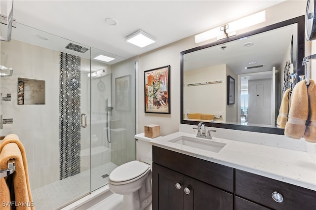 6361 Pelican Bay Blvd Unit 605, Naples, FL 34108 - bathroom featuring a shower stall, vanity, and toilet